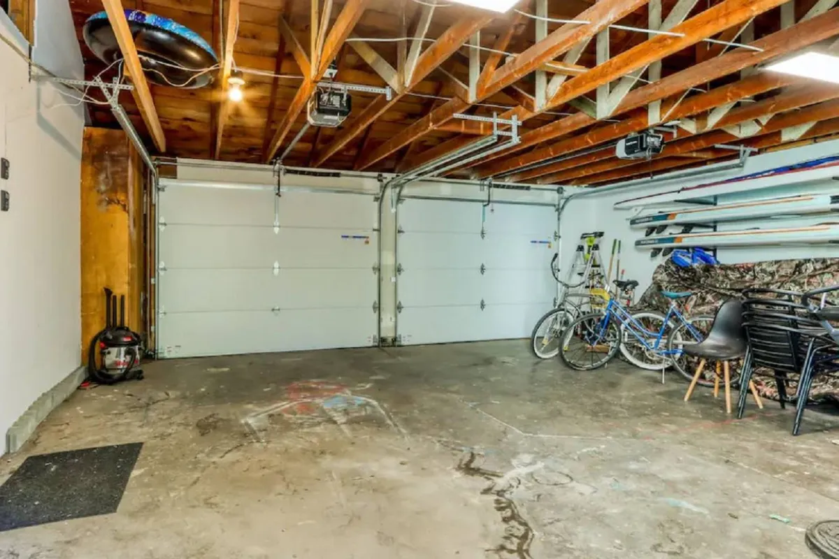 An organized garage with bicycles and storage racks, hinting at adventure and an active lifestyle. The presence of bikes suggests guests can explore the neighborhood and nearby attractions easily, reinforcing the area’s accessibility.